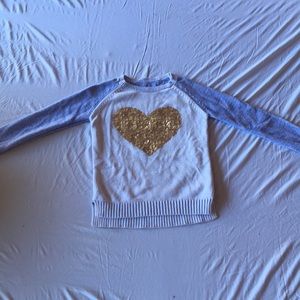 Blue, white, and gold sweater